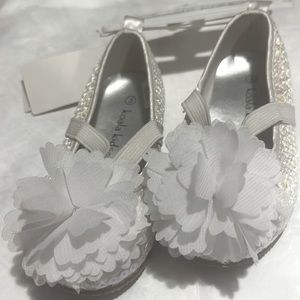 White sequined ballerina slippers with 3D flower